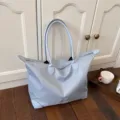 Large capacity travel tote bag in light blue, perfect for short trips and daily storage needs. - Blue