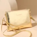 Metallic gold finish crossbody shoulder bag with sleek clutch design and detachable strap. - Gold