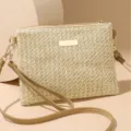 Chic straw woven crossbody bag for women, stylish summer beach shoulder bag with metal accent. - Straw