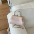 Elegant pink plaid evening handbag with gold kiss-lock frame and chic chain strap for women. - Pink