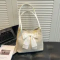 Woven straw tote bag with white bow, large capacity casual shoulder bag for women daily use. - White