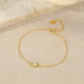 Elegant gold sterling silver bracelet with sun charm and adjustable chain design. - Gold Sun Bracelet