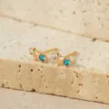 Pendientes de tuerca de estrella dorada con piedras blancas y azules, joyería de plata SKU. - Oro Champán 14K Marzo Azul Oscuro