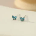 S925 zilveren blauwe diamant vlinder oorknopjes voor vrouwen, stijlvolle stapelbare sieraden. - Platina Diep Zeeblauw