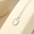Zilveren dierenriemketting met witte schelp ovaal hanger, delicate variant stijl. - Platinage - Steenbok