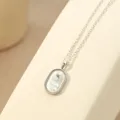 S925 sterling zilveren sterrenbeeld ketting met ovalen witte schelp hanger en Waterman design. - Platinage - Waterman