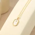 Vergulde zilveren dierenriem hanger ketting voorzien van witte moerbeiparel en ster detail. - 14K Champagne Goud - Weegschaal