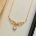 Variante de collar de corazón con alas de ángel doradas, fina cadena de plata esterlina. - NS3851 - Oro champán de 14K