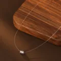 Silver invisible fishing line necklace with sparkling cylinder pendant for women daily wear. - Mini Barrel Style (White Gold)