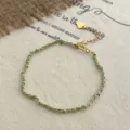 Elegant woven curb chain bracelet with turquoise thread, extension chain and heart charm. - 925 Silver / Gold-Cyan