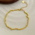 Elegant yellow woven bracelet with silver-tone chain and cute heart extension detail. - 925 Silver / Gold-Tone Yellow