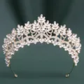 Detailed view of the sparkling crystal bridal tiara with marquise stones and gold finish. - KC Gold White Rhinestone