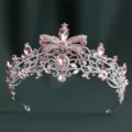 Detailed close-up of the sparkling Baroque rhinestone bridal crown featuring pink crystal bow design. - H1557 Thick Silver with White & Light Pink Rhinestones