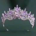 Close-up detail of a stunning purple crystal baroque tiara crown with delicate butterfly wings. - H1560 Thick Silver with White & Crystal Purple Rhinestones
