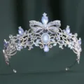 Exquisite silver bridal tiara detailed with sparkling rhinestones and light blue crystals. - H1557 Thick Silver with White & Blue Jelly Rhinestones