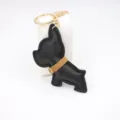Schwarze Leder Bulldogge Schlüsselanhänger süßer Welpe Taschenanhänger mit goldener Hardware. - Schwarz