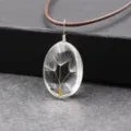 Handmade natural dandelion seed oval clear resin pendant necklace with brown cord. - Three Dandelions (Oval)