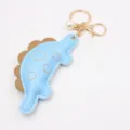 Cute blue dinosaur leather keychain pendant with gold hardware and pearl, ideal bag charm. - Light Blue