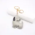 Cute cartoon puppy leather keychain pendant, soft cotton-filled 3D design for bags and car keys. - Gray