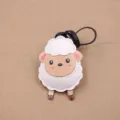 Cute sheep PU leather bag charm keychain pendant detailed view showing stitching clearly. - Frontal Standing Lamb Charm / White