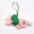 Close-up detail of the pink and green elephant leather charm pendant for bags and jeans. - Pink - Green Wings