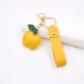 Yellow apple leather keychain cute bag pendant with gold hardware daily accessory detail - Yellow