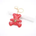 Red crocodile pattern leather bear keychain with gold hardware and chic necklace pendant. - Red