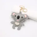 Cute gray leather koala keychain detail, soft texture and sturdy gold metal ring for bags. - Keychain / Gray