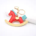 Leather rocking horse keychain bag charm cute cartoon key ring fashion accessory details. - Red