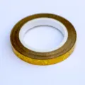 Close-up detail view of a shiny gold holographic balloon ribbon roll, perfect for party decor. - Gold