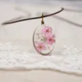 Handmade oval resin dried flower pendant necklace short clavicle jewelry detail view - Pink
