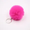 Close-up of hot pink fluffy pom pom keychain with silver metal ring, plush bag charm detail - 8cm Faux Fur + Single Ring Clasp / Rose Red