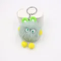 Close-up detail of the cute green plush toy keychain with fluffy ball and soft rabbit ears. - Matcha Green