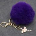 Llavero de pompón morado esponjoso con colgante de bailarina de diamantes para bolso. - Bailarina - Pelo de conejo Rex sintético / Púrpura profundo