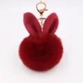 Cute rabbit ear plush pompom keychain, fluffy faux fur bag charm accessory detail. - Burgundy