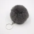 Grey fluffy plush pom pom keychain detailed view, soft faux fur bag charm and car pendant. - 8cm Faux Fur + Single Ring Clasp / Dark Gray