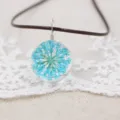 Handmade dried flower glass ball necklace with blue floral pendant on brown cord view - Blue