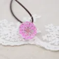 Handcrafted dried flower glass ball necklace with pink lace floral pendant and brown leather cord. - Rose Red