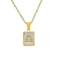Close-up detail of 18K gold plated Libra zodiac sign pendant with mother of pearl inlay - Libra