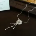 Elegant zircon camellia flower tassel necklace detail, exquisite clavicle chain jewelry for women. - Camellia Tassel Necklace / Silver