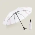 Portable folding umbrella with baseball seam design sun and rain protection compact style. - Baseball Umbrella / 23 Inch