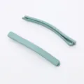 Close-up detail of minimalist matte hair clip, smooth texture, elegant light blue color. - Light Blue