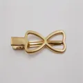 KC gouden metalen holle eendebek haarclip, stijlvolle minimalzen pony clip voor DIY accessoire. - Vlinderdas Stijl