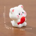 Cute miniature white cat figurine holding a red fish with size dimensions 2.3x1.9cm - 2.3x1.9x1.9cm