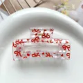 Detailed view of square transparent hair claw clip with sweet red bows and hearts print. - Type F Square Thermal Transfer (8.5cm) / Clear