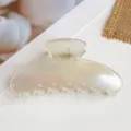 Close up of iridescent PC hair claw clip, sleek pearl finish for elegant half-up styling. - PC Electroplated Square-Transparent Matte AB Color