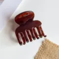 Small brown tortoiseshell hair claw clip accessory for elegant daily half up hairstyles. - Transparent Amber