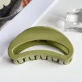 Close up view of a sleek olive green curved hair claw clip, perfect for styling up dos. - Moon Style (PC 7cm Moon Clip) / Glossy Army Green