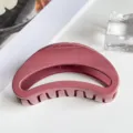 Close-up detail shot of the elegant curved hair claw clip in a stylish mauve glossy finish. - Moon Style (PC 7cm Moon Clip) / Glossy Wine Red