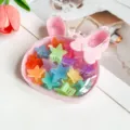 Boite de rangement rose lapin remplie de pinces a cheveux etoilees colorees pour filles. - Boîte Lapin Pinces Étoile / 15 Pièces (2.5cm) / Couleur Gelée